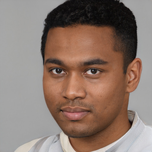 Neutral black young-adult male with short  black hair and brown eyes