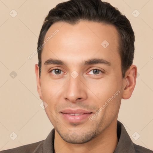 Joyful white young-adult male with short  brown hair and brown eyes