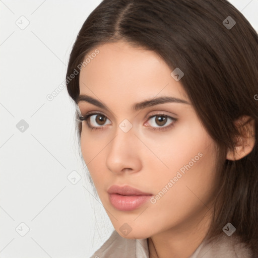 Neutral white young-adult female with long  brown hair and brown eyes