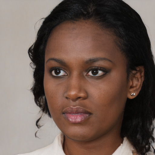 Neutral black young-adult female with medium  black hair and brown eyes
