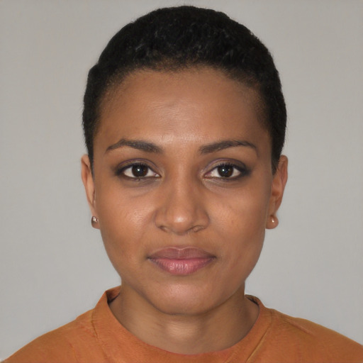 Joyful black young-adult female with short  black hair and brown eyes