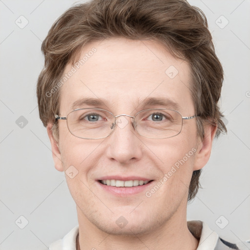 Joyful white adult male with short  brown hair and grey eyes