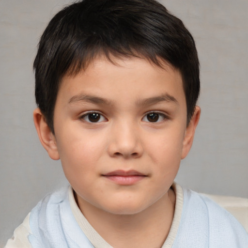 Joyful white child male with short  brown hair and brown eyes