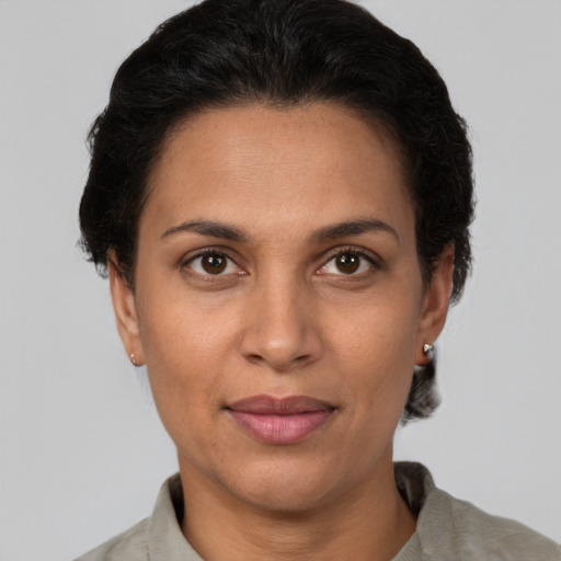 Joyful white adult female with short  brown hair and brown eyes