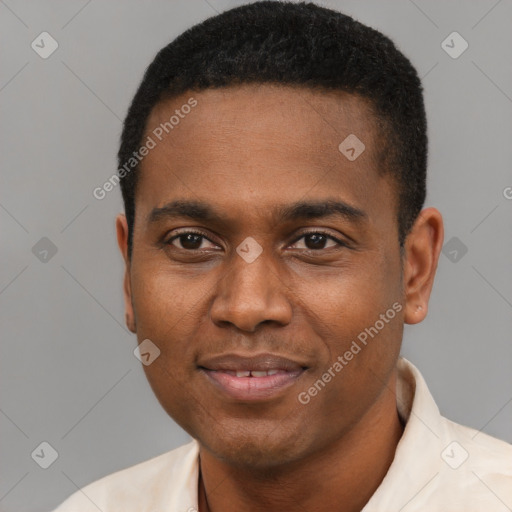 Joyful black young-adult male with short  black hair and brown eyes