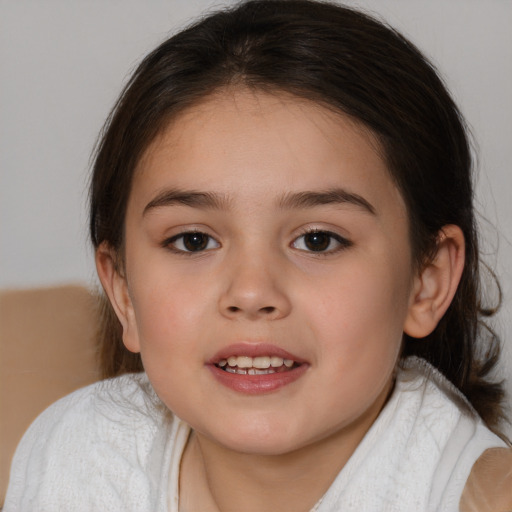 Joyful white child female with medium  brown hair and brown eyes