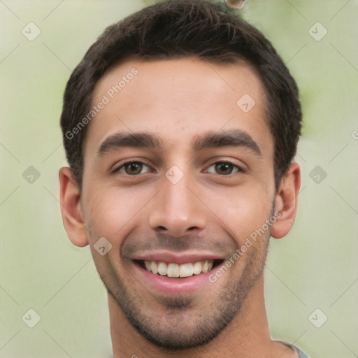 Joyful white young-adult male with short  black hair and brown eyes