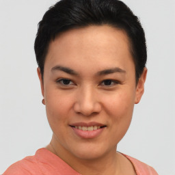 Joyful asian young-adult female with short  brown hair and brown eyes