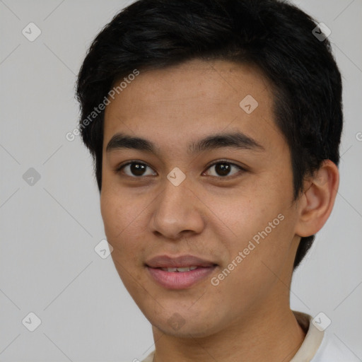 Joyful asian young-adult male with short  black hair and brown eyes