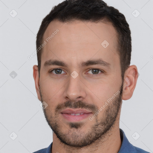 Joyful white young-adult male with short  brown hair and brown eyes