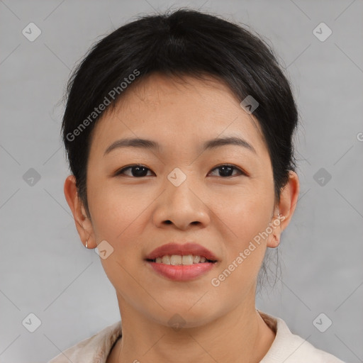 Joyful asian young-adult female with short  brown hair and brown eyes