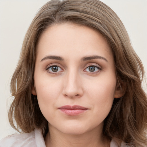 Neutral white young-adult female with long  brown hair and blue eyes