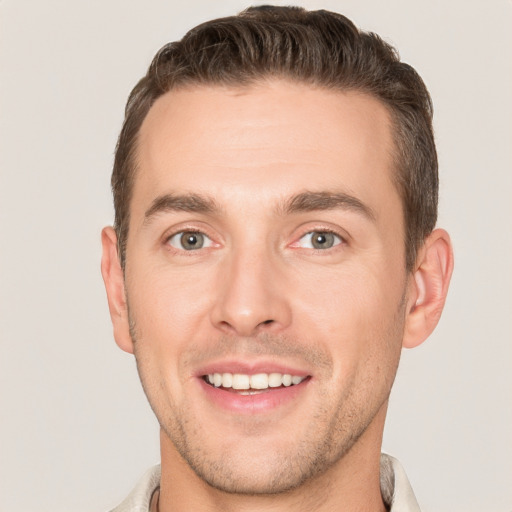 Joyful white young-adult male with short  brown hair and brown eyes