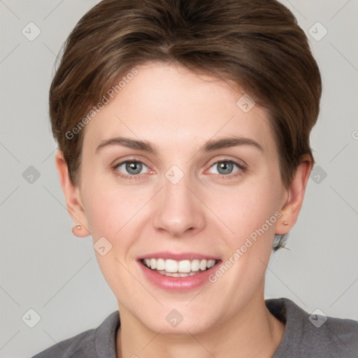 Joyful white young-adult female with short  brown hair and grey eyes