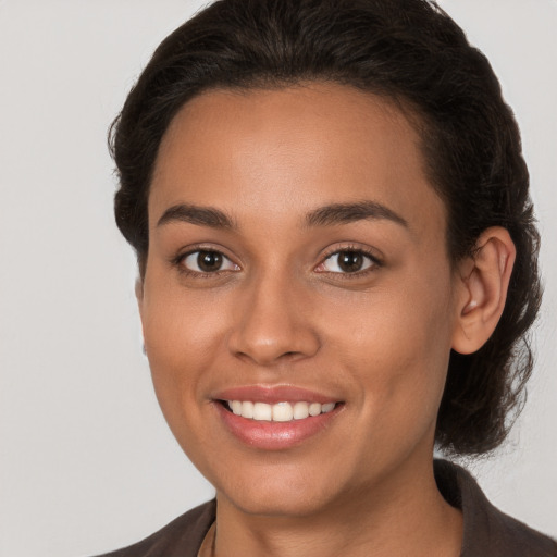 Joyful white young-adult female with medium  brown hair and brown eyes