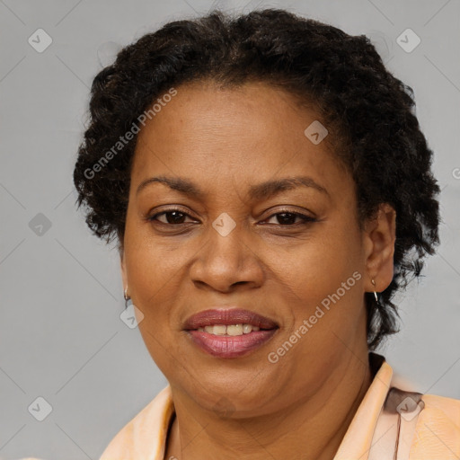 Joyful black adult female with short  brown hair and brown eyes