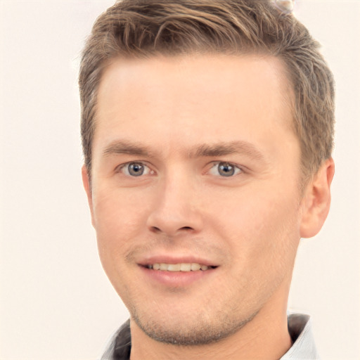 Joyful white young-adult male with short  brown hair and brown eyes