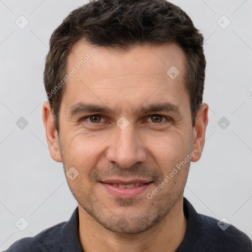 Joyful white adult male with short  brown hair and brown eyes