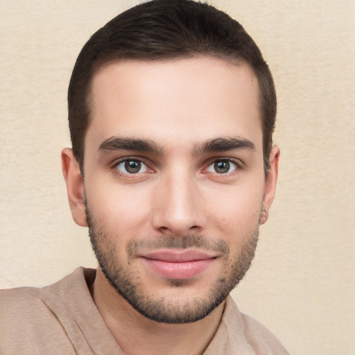 Joyful white young-adult male with short  brown hair and brown eyes