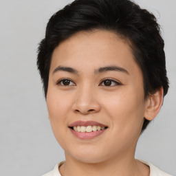 Joyful asian young-adult female with short  brown hair and brown eyes