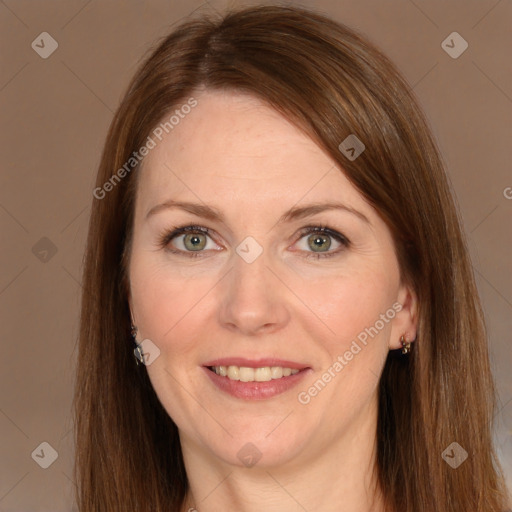 Joyful white adult female with long  brown hair and grey eyes