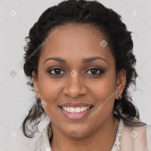 Joyful black young-adult female with long  brown hair and brown eyes