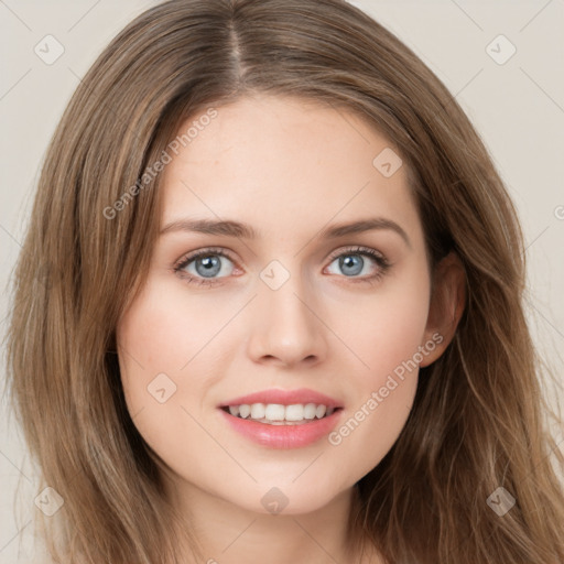 Joyful white young-adult female with long  brown hair and green eyes