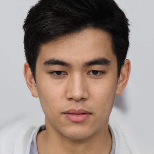 Neutral asian young-adult male with short  brown hair and brown eyes