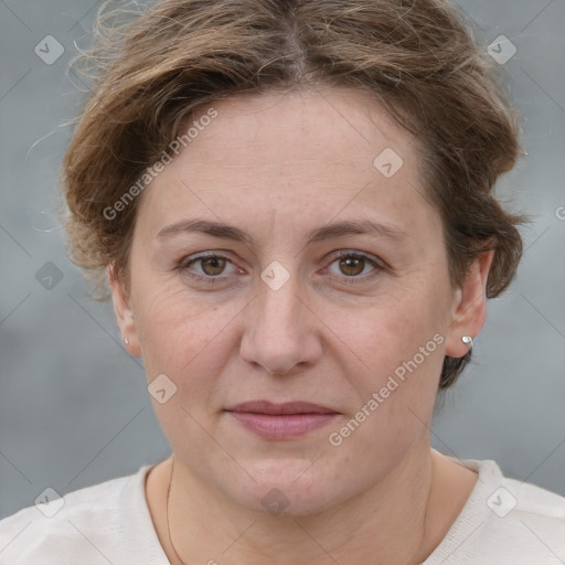 Joyful white adult female with short  brown hair and grey eyes