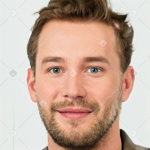 Joyful white young-adult male with short  brown hair and blue eyes