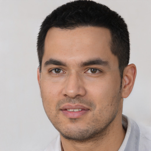 Joyful asian young-adult male with short  black hair and brown eyes