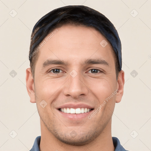 Joyful white young-adult male with short  brown hair and brown eyes