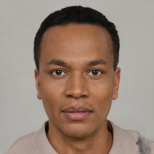 Neutral black young-adult male with short  black hair and brown eyes