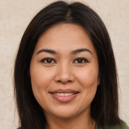 Joyful asian young-adult female with long  brown hair and brown eyes