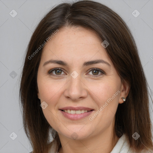 Joyful white adult female with medium  brown hair and brown eyes