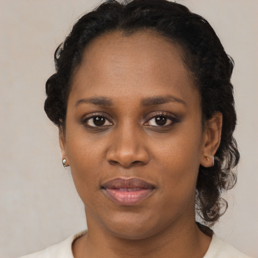 Joyful latino young-adult female with short  black hair and brown eyes