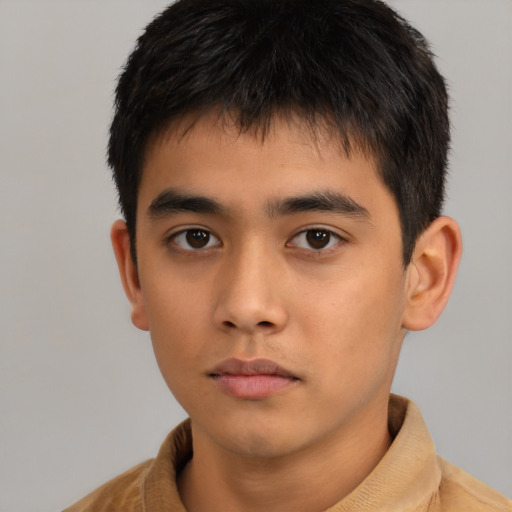Neutral asian child male with short  brown hair and brown eyes