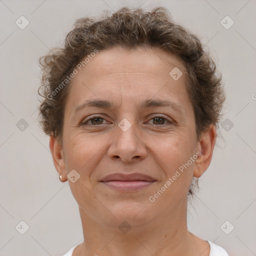 Joyful white adult female with short  brown hair and brown eyes