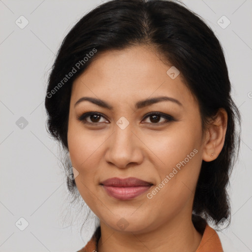 Joyful latino young-adult female with medium  brown hair and brown eyes