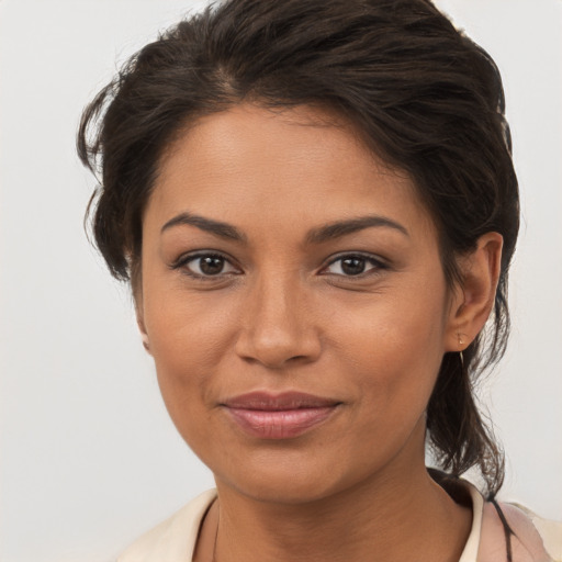 Joyful white young-adult female with medium  brown hair and brown eyes