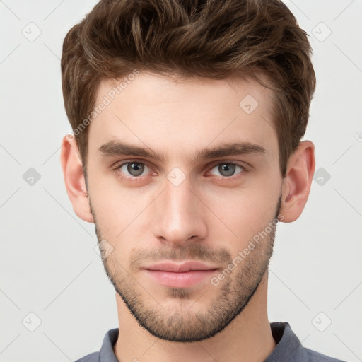 Neutral white young-adult male with short  brown hair and grey eyes