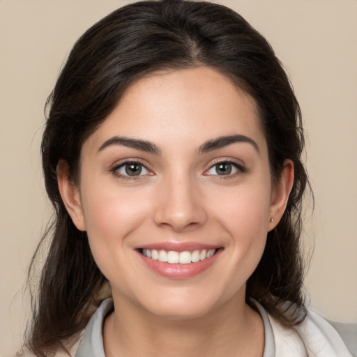 Joyful white young-adult female with medium  brown hair and brown eyes