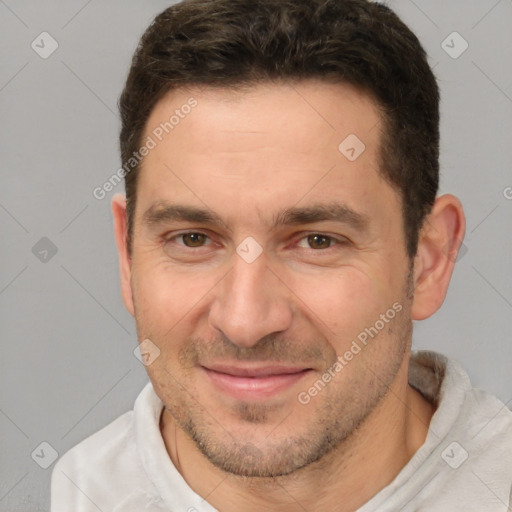 Joyful white adult male with short  brown hair and brown eyes