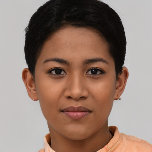 Joyful asian young-adult female with short  black hair and brown eyes