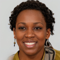 Joyful black young-adult female with short  brown hair and brown eyes