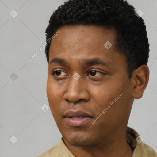 Neutral latino young-adult male with short  black hair and brown eyes
