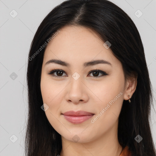 Joyful latino young-adult female with long  brown hair and brown eyes