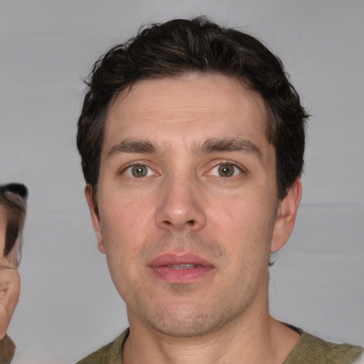 Neutral white adult male with short  brown hair and brown eyes