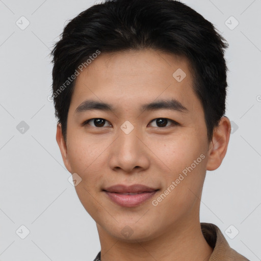 Joyful asian young-adult male with short  black hair and brown eyes