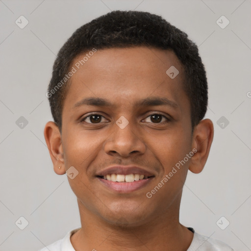 Joyful black young-adult male with short  brown hair and brown eyes